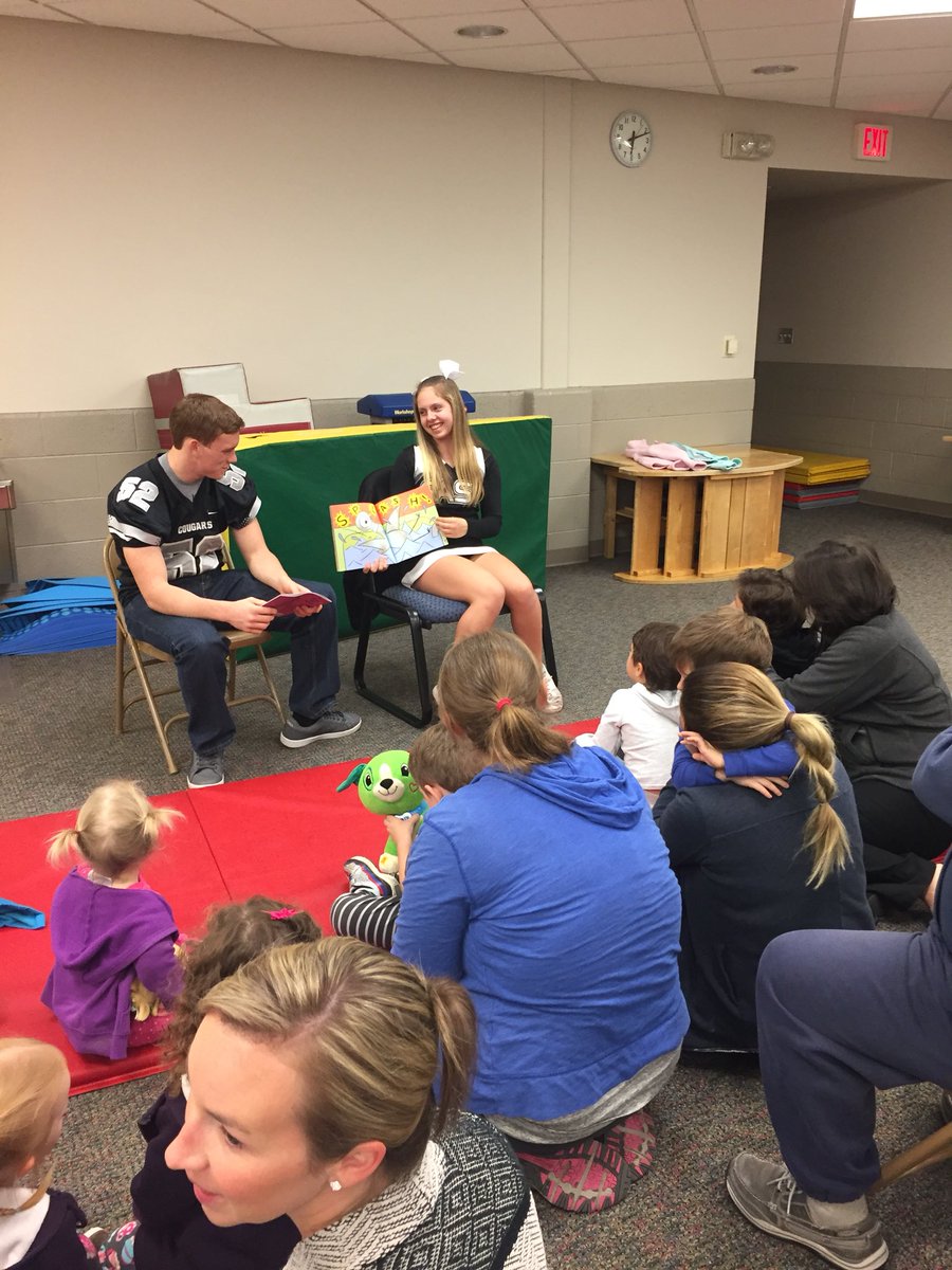 slcsecc's tweet photo. Excitement at the ECC! South Lyon East varsity football and cheer were the guest readers for story night! https://t.co/xtW4hdjElA