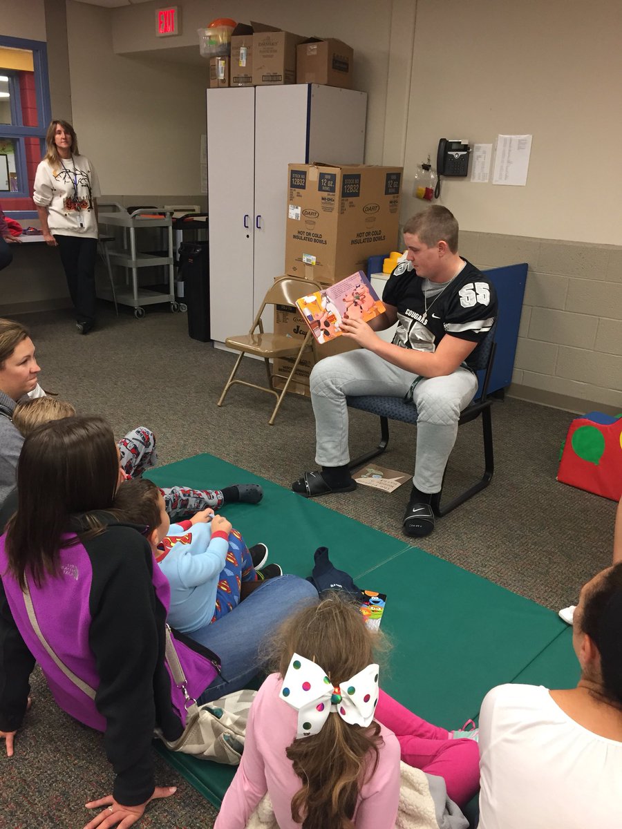 Excitement at the ECC! South Lyon East varsity football and cheer were the guest readers for story night!