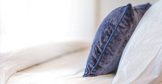 Trend of white bed with colorful pillows. If you want to bring some elegance with cushions, velvet should be your election. Boheme fabrics