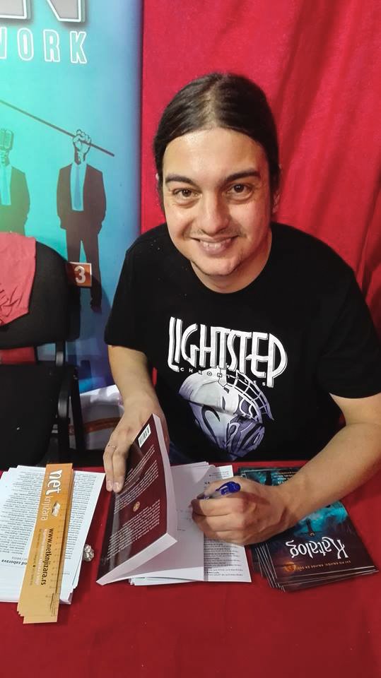 colony_66's tweet photo. Our colleague and writer extraordinaire Ivan Branković representing team #LSC at this year's #BelgradeBookFair. Knock 'em dead, Ivan! https://t.co/bJozJBCfAb