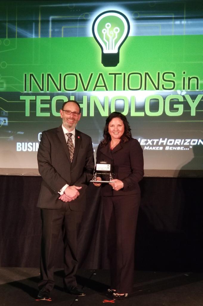 _GuideWell's tweet photo. Head of GuideWell Innovation @ReneeRFinley accepts the #InnovationsInTech award from @Robert4OBJ for the GuideWell Innovation Center https://t.co/nT90Ye3ldH