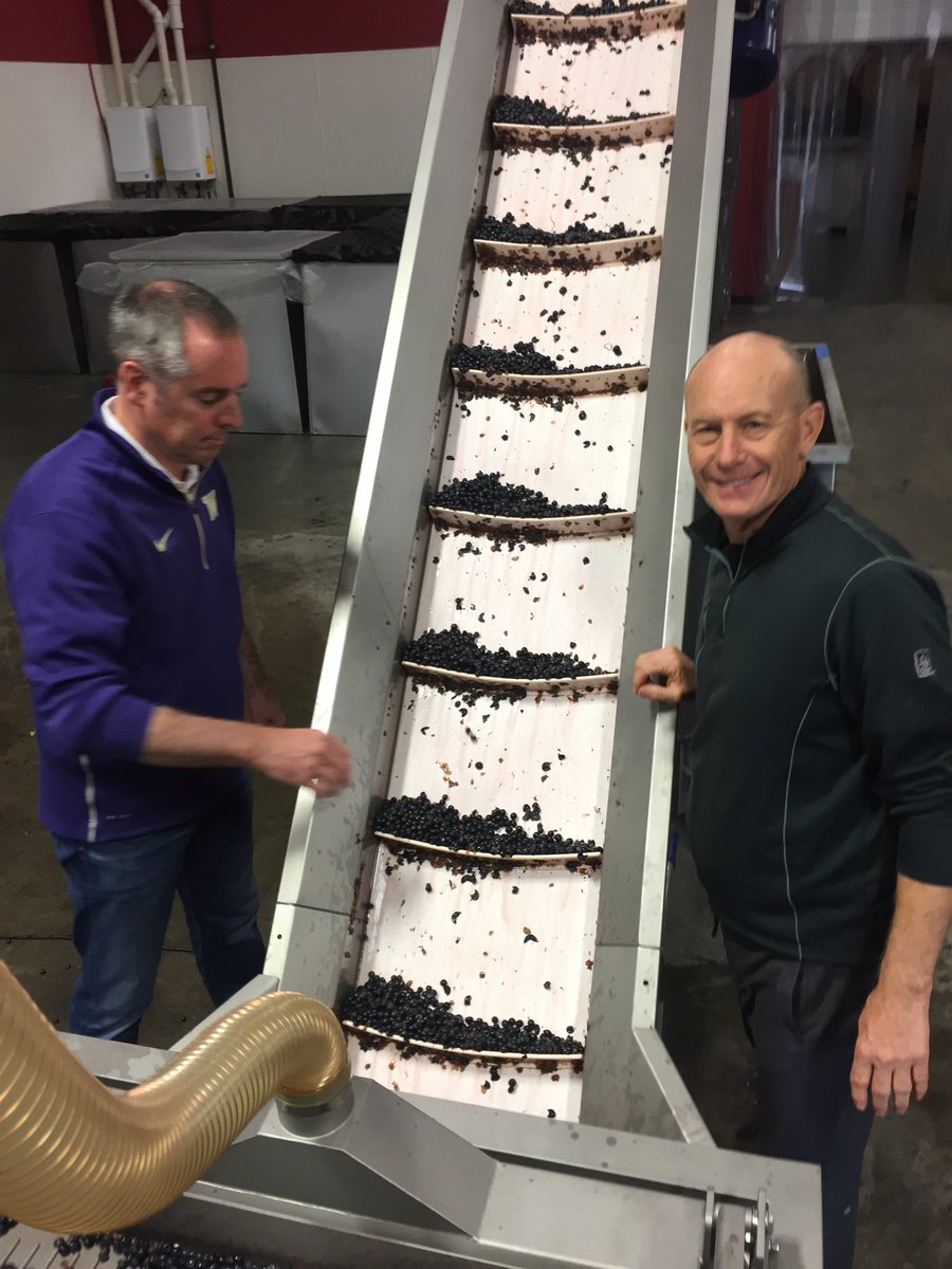 PassingTimeWine's tweet photo. Kevin & Doug were hard at work crushing fruit from #Champoux and #Pepperbridge earlier this week. #WAWine https://t.co/NeqMPdLMg1