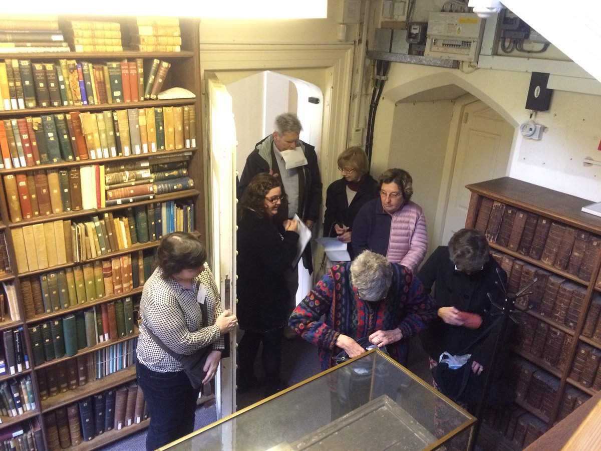 Queens_Lib's tweet photo. Reader Services Librarian Lucy and Library Assistant Lise welcome visitors for our second workshop on Tudor Bookbinding #CFI2017 https://t.co/FyjWnUHXTi