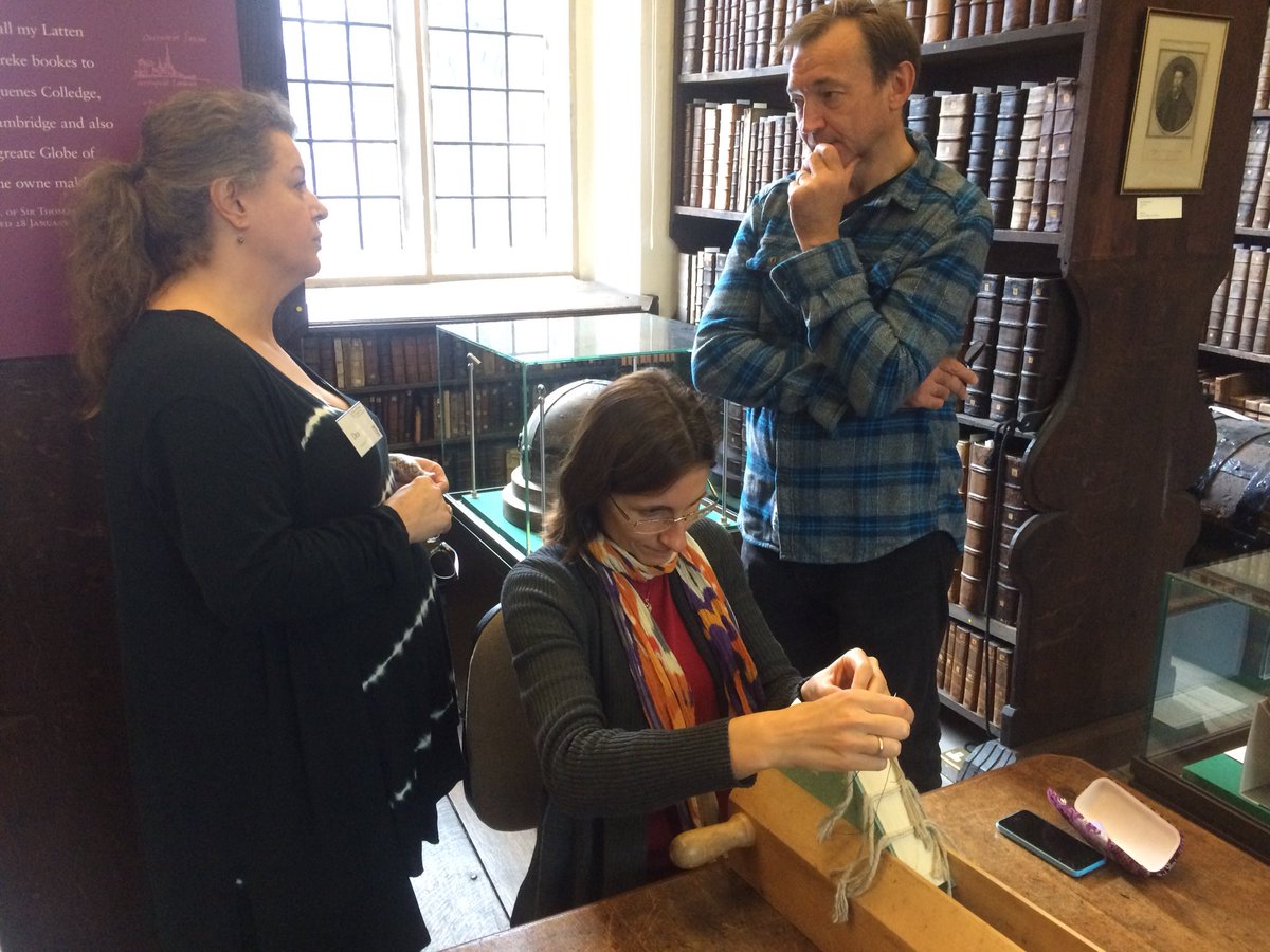 Queens_Lib's tweet photo. Conservator Dea teaches how to create a secondary headband using coloured threads #CFI2017 https://t.co/fJ6aAvfrAs