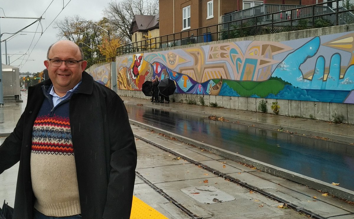 berryonline's tweet photo. A wet morning made beautiful as we unveiled this #Canada150 commemorative artwork in @DTKitchener on Charles Street near Cameron St today. Thx to @NerudaArts and the 150 #WRAwesome artists part of this great mural! #LoveMyHood #Placemaking #Diversity https://t.co/V7k8I0TePb