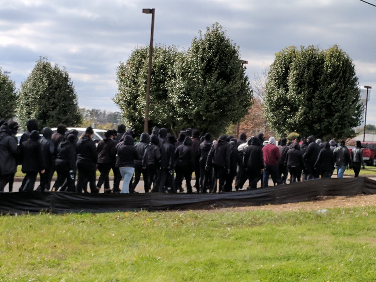 TI_Progressive's tweet photo. "We got your back-we got your back!"

At the Murfreesboro TN counter protest to WLM. Antifa group patrolling the outside of the town square. https://t.co/eKMkTrojP0