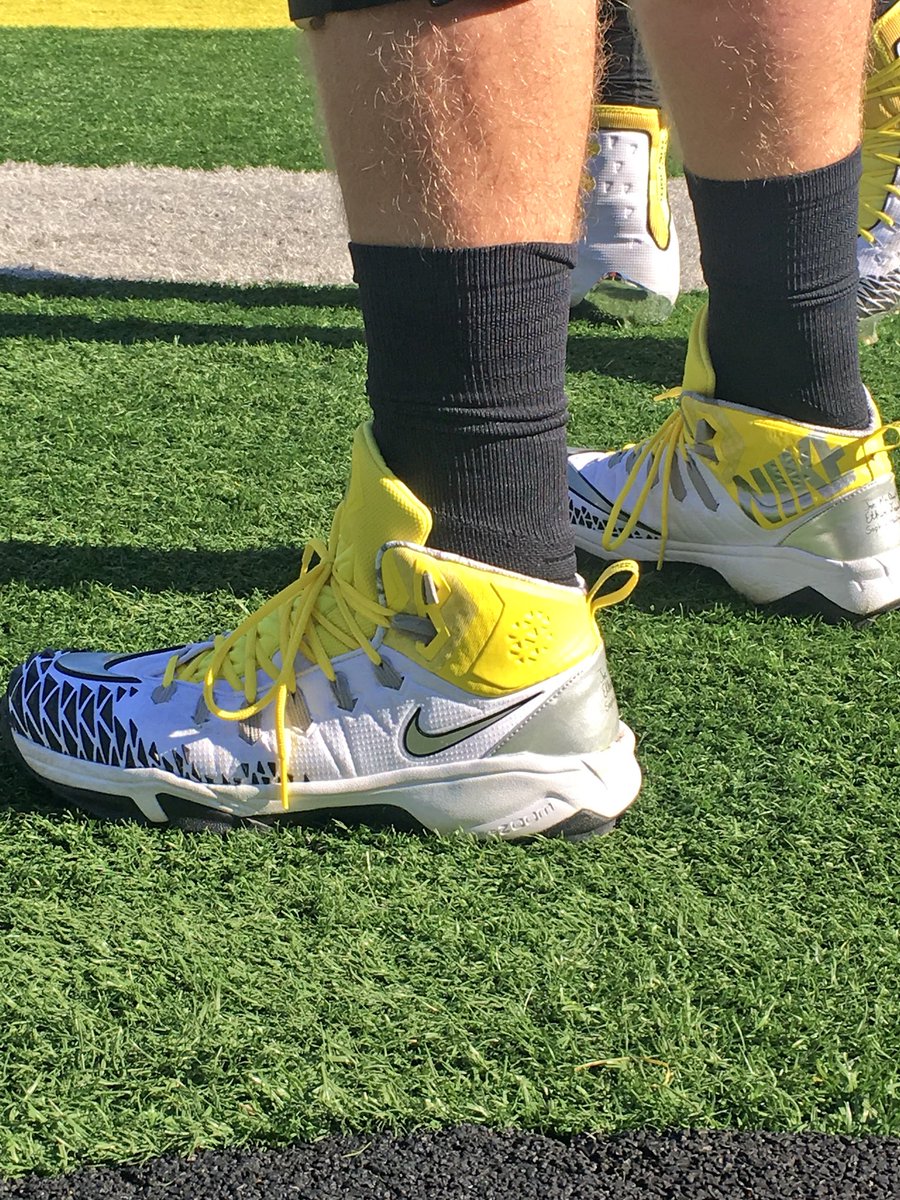 Closer look at oregonfootball uniform matte black helmet & shoe game ⚫️ ...