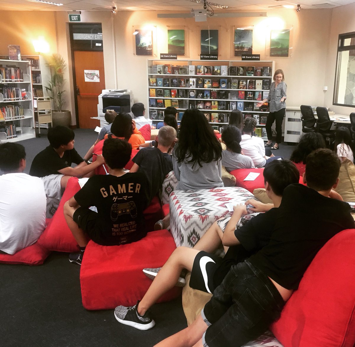 JISMSLibrary's tweet photo. Grade 8 students enjoying book talks from core library. Books flew off the shelf! #awesomebooks #lovereading #newgenres https://t.co/TW1xvHYLq6