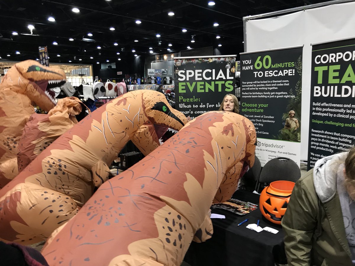 EnigmaEscapes's tweet photo. Itโs the last day of #Comicon & even the T-Rexes came by to visit! See us to enter a draw for a $150 GC! #C42017 #enigmaescapes https://t.co/CyxZaWpJX6