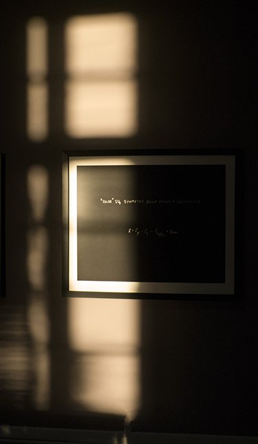 Murray Gell-Mann's "Color SU(3)" equation hanging in SFI's Noyce conference room. (Photo: Samine Joudat)