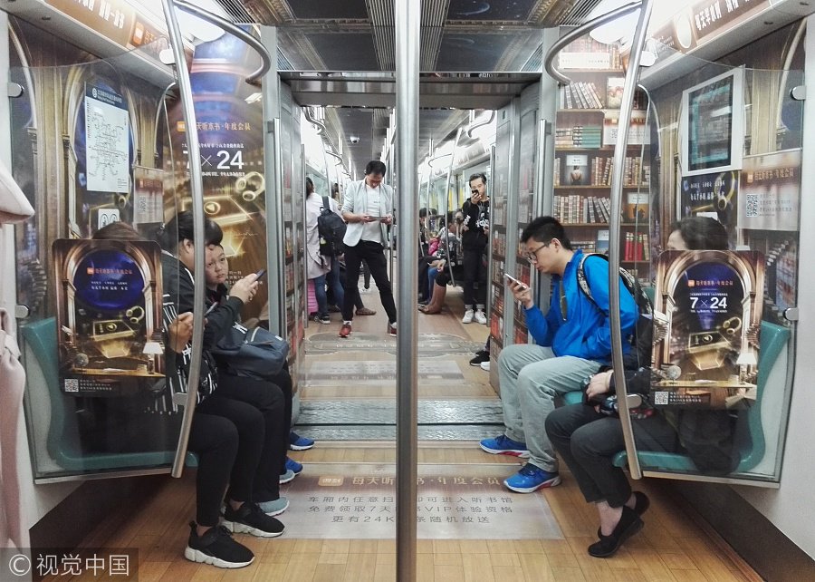 ChinaDaily's tweet image. A #library? No, a #subway carriage. Passengers can use their cellphones to sweep the code and then listen to the audio-books. (Photos: VCG)