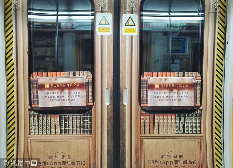 ChinaDaily's tweet image. A #library? No, a #subway carriage. Passengers can use their cellphones to sweep the code and then listen to the audio-books. (Photos: VCG)