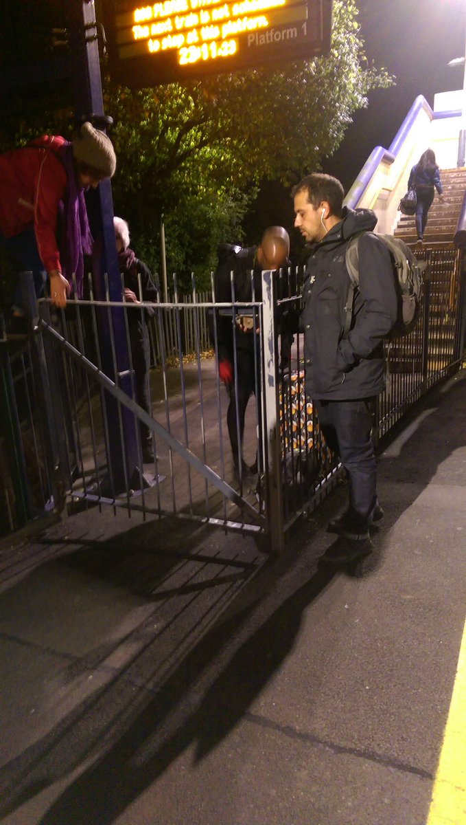 VHitkari's tweet photo. GWR at Langley, station. Train arrives, gates locked! Climbing and injuring ourselves, no response to email I sent, sad!@GWRHelp @NRE_GWR https://t.co/tSAROSspqV
