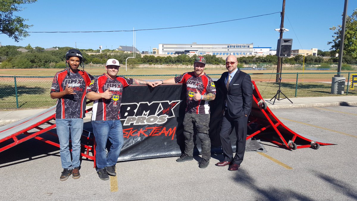 Principal Wernli with the BMX "Perfection on Wheels" team (after they jumped over him!)