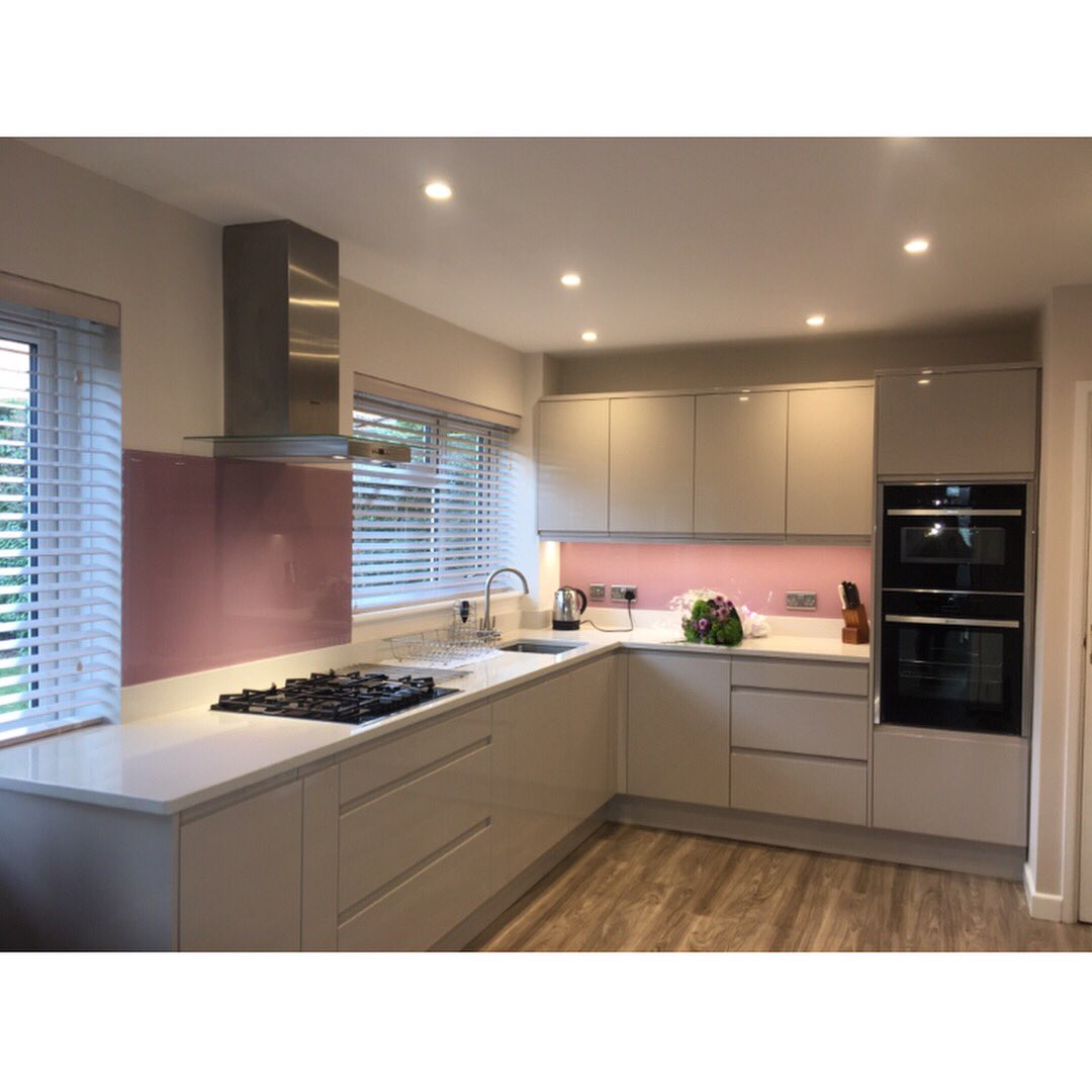 Recently fitted for a client in Andover - a contemporary handleless design in Strada Cashmere with Quartzforms worktops and Neff appliances.