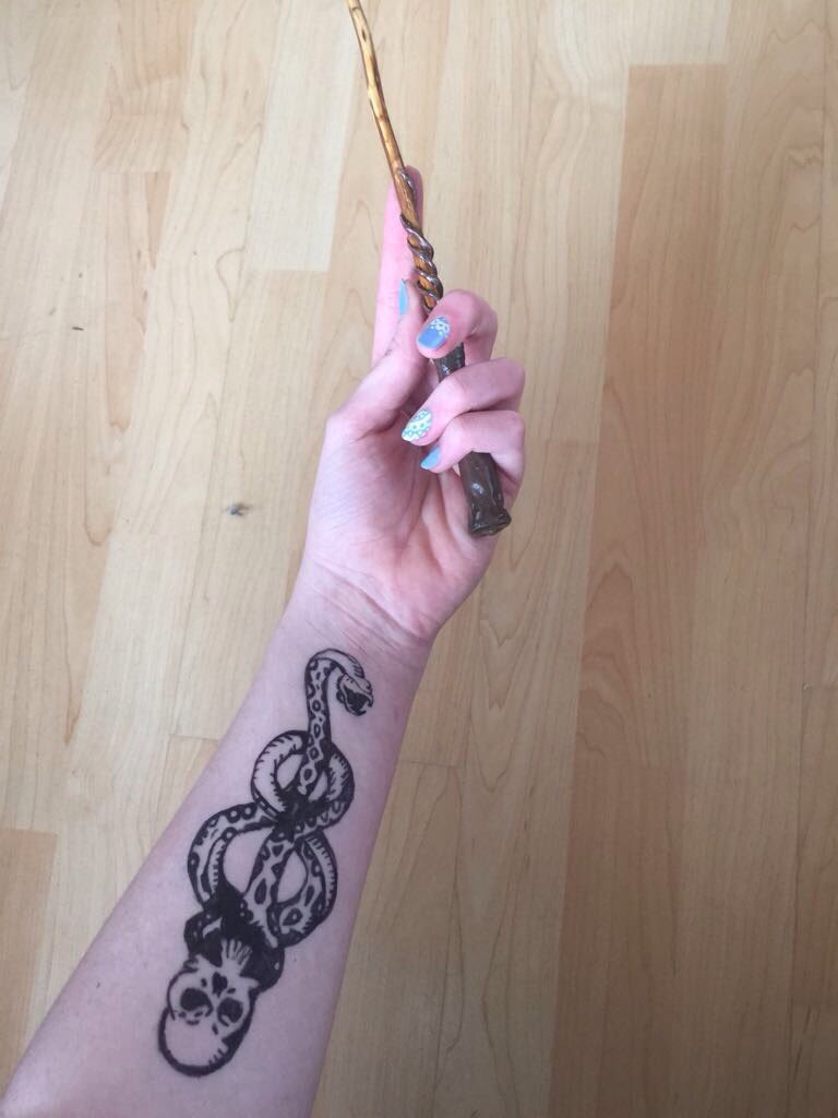 NWoulfeWriter's tweet photo. Daughter drew a Harry Potter dark mark on her arm today, here she's holding one of her homemade wands ... #pottermad #samhain #halloween https://t.co/R2csAQrIxP