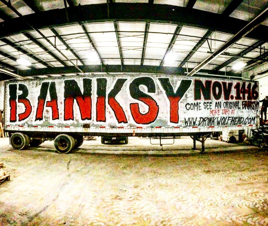 DrinkWolfhead's tweet photo. Now this is what we call an advertisement!! #drinkwolfhead #wolfheaddistillery #banksy #wallsonfire #savingbanksy https://t.co/853fSsFn8y