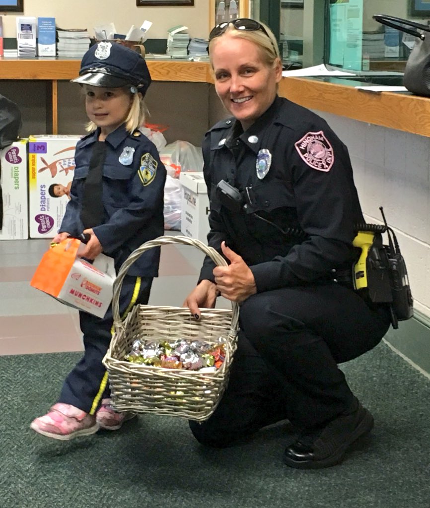 HinghamPolice's tweet photo. Thanks to Vivian, here with Ofc. Lisa McCracken, for being our 1st trick or treater. She's wearing one of our favorite costumes. #Halloween https://t.co/GpSu85A8La