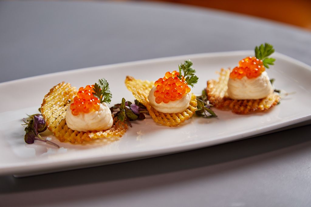 No tricks, all TREATS! No tricks, all treats. Try our uni mousse on yukon gold gaufrette with smoked trout caviar.