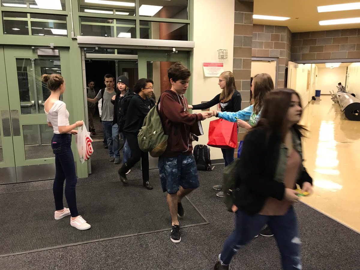 MrMartyLang's tweet photo. Members of the YANA club greeted students as they arrived on campus today with an affirmation, a smile, and a sweet treat! #ERHSpride https://t.co/0lbLPIENrk
