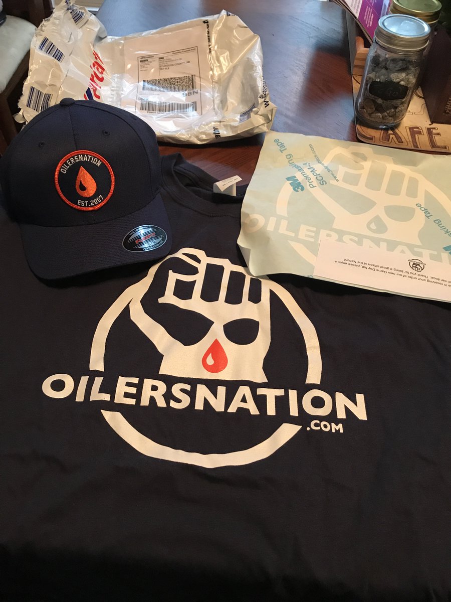 Smyth94ever's tweet photo. EEEE! My new @OilersNation hat & tee (finally) arrived just now. Not gonna lie I’m stoked to wear it! #BonusSticker #Oilersnation #Oilers ❤️ https://t.co/5g2IkP6Cmd