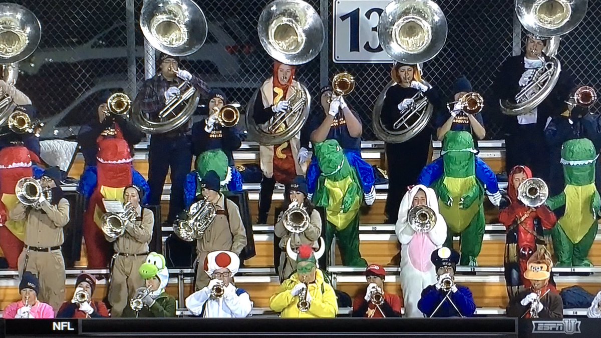 RedditCFB's tweet photo. Nice costume coordination by the @ksumgf trombone section—also bonus Deadpool: #MACtion #BGSUvsKENT #Halloween https://t.co/Vj5aYsdA2p