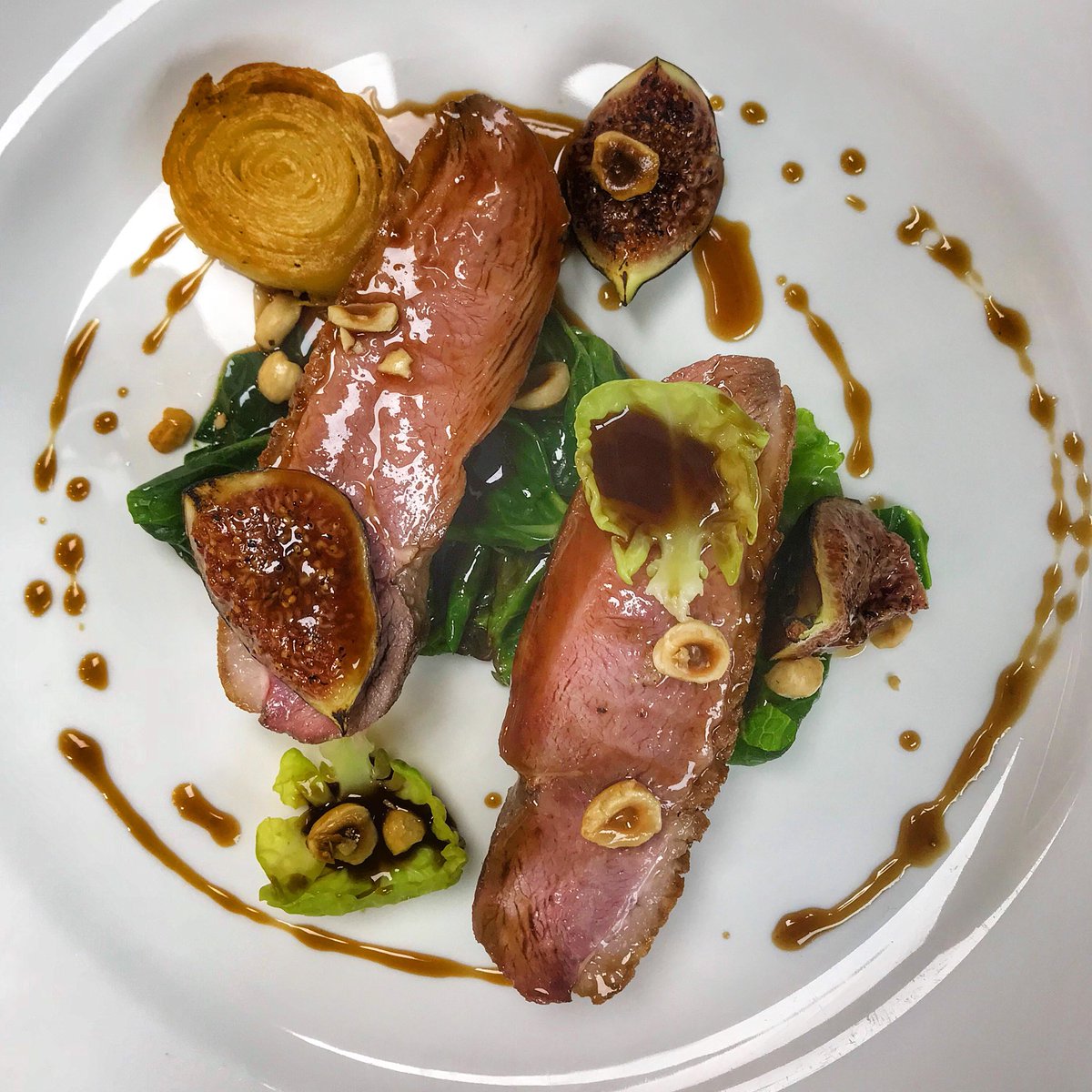 Roast Devonshire duck, figs, sprout tops and hazelnuts