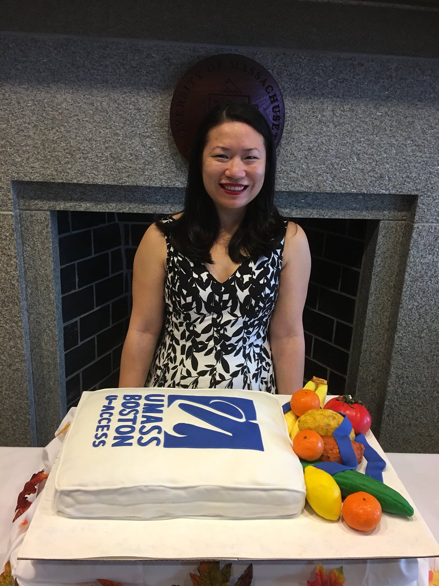 Jeney Zhang with the UMass Boston cake she baked.