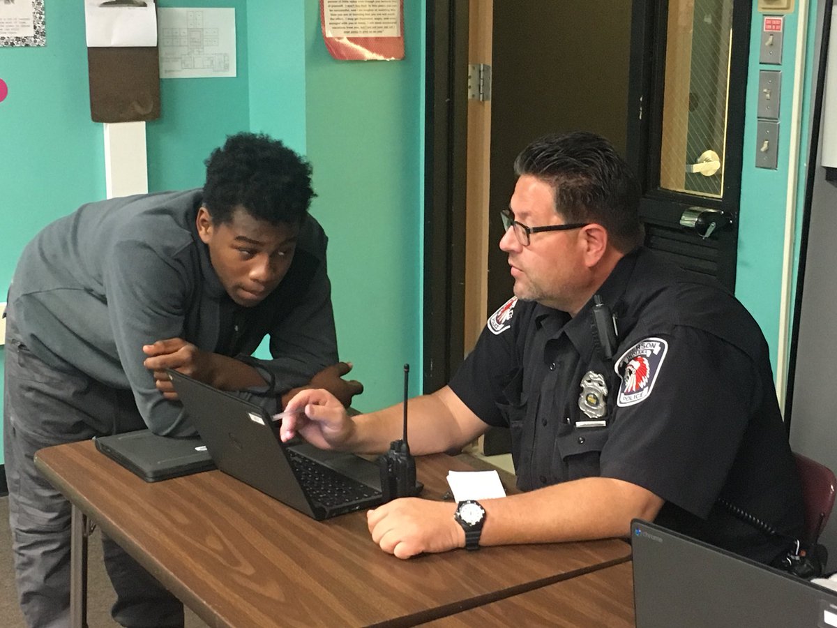 AtownCOMPASS's tweet photo. Our awesome school resource officer helps to tutor kids when they need help! #compassrocks #apd #officermccannisthebest https://t.co/HpCaZxuK07