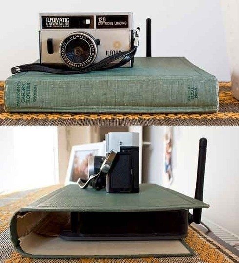 marcymckenna's tweet photo. This is such a great trick to keep that unsightly router hidden! Use an old book cover to conceal on a table or your mantel.  #SimplySolved https://t.co/Fmo3BUaWnm