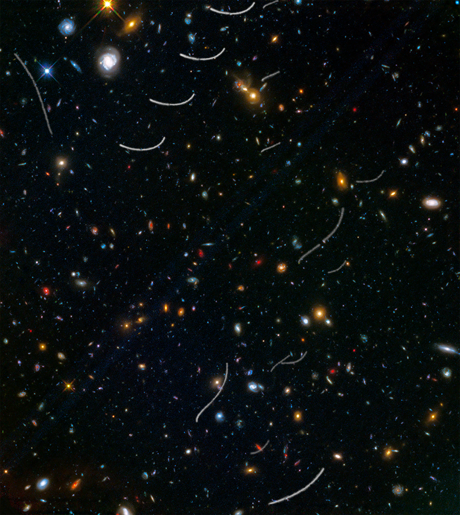 NASA's tweet photo. Cosmic photobomb? See how streaks of local asteroids passed in front of @NASAHubble’s view of the universe: https://t.co/r2ndmlM8Zo https://t.co/YJ10l55uSP