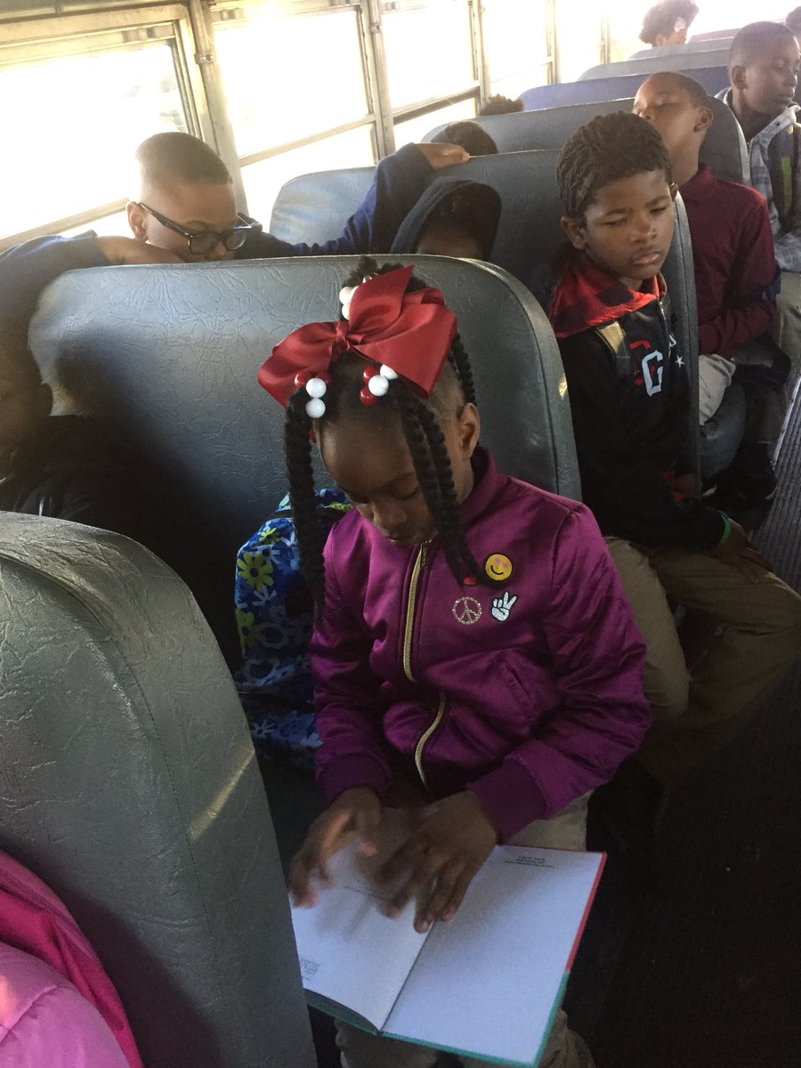 DrJJames5's tweet photo. Promoting literacy everywhere! Reading on our way to school. #greenbus #CPES https://t.co/H792DYCizq