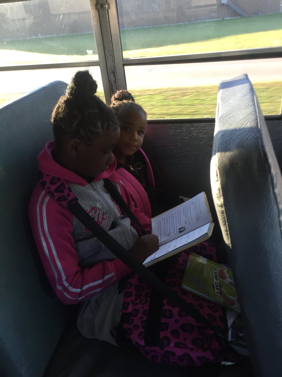 DrJJames5's tweet photo. Promoting literacy everywhere! Reading on our way to school. #greenbus #CPES https://t.co/H792DYCizq