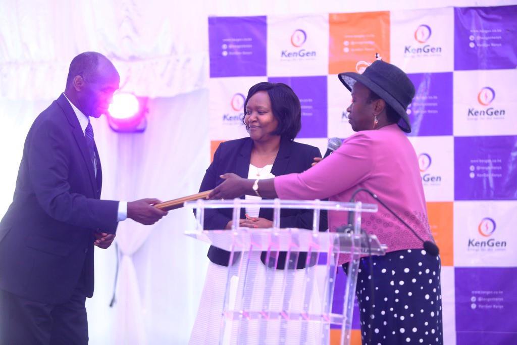 KenGenKenya's tweet photo. .@rebecca_miano receives a symbolic baton from her predecessor to signify change of guard at KenGen.#ThankYouAlbert #ChangeOfGuardKenGen https://t.co/dDZEIx3yGB