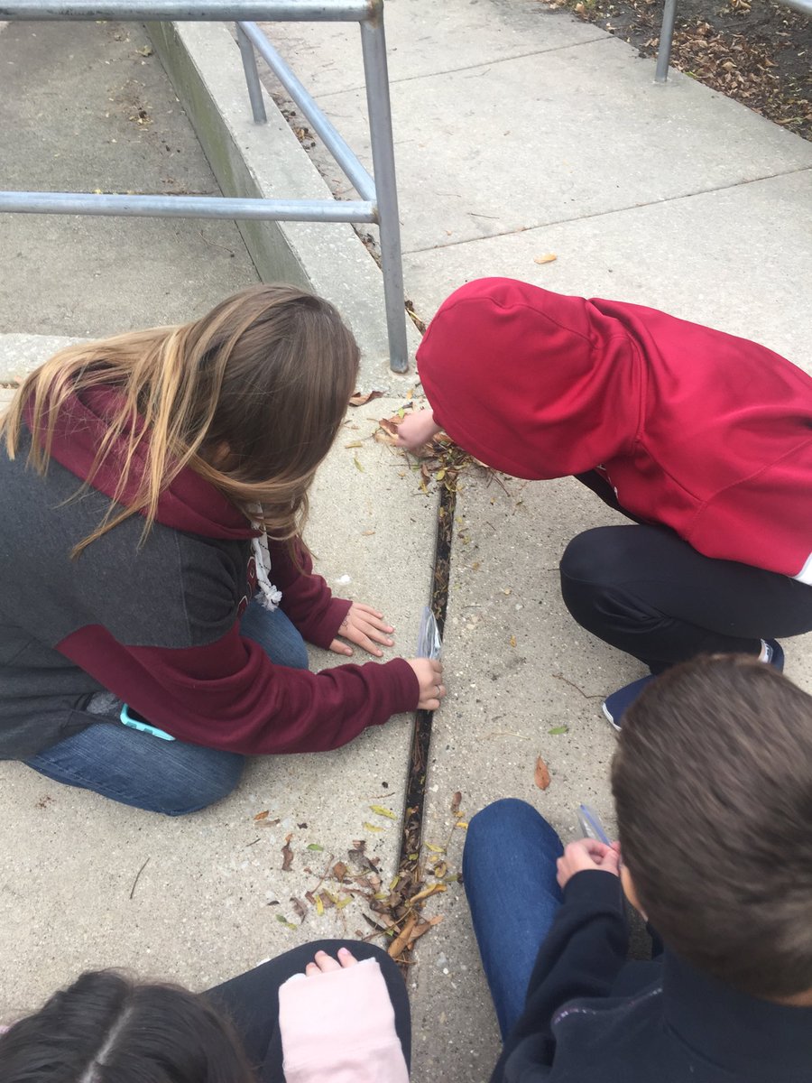 8th Grade Science students working outside to find micrometeorites!