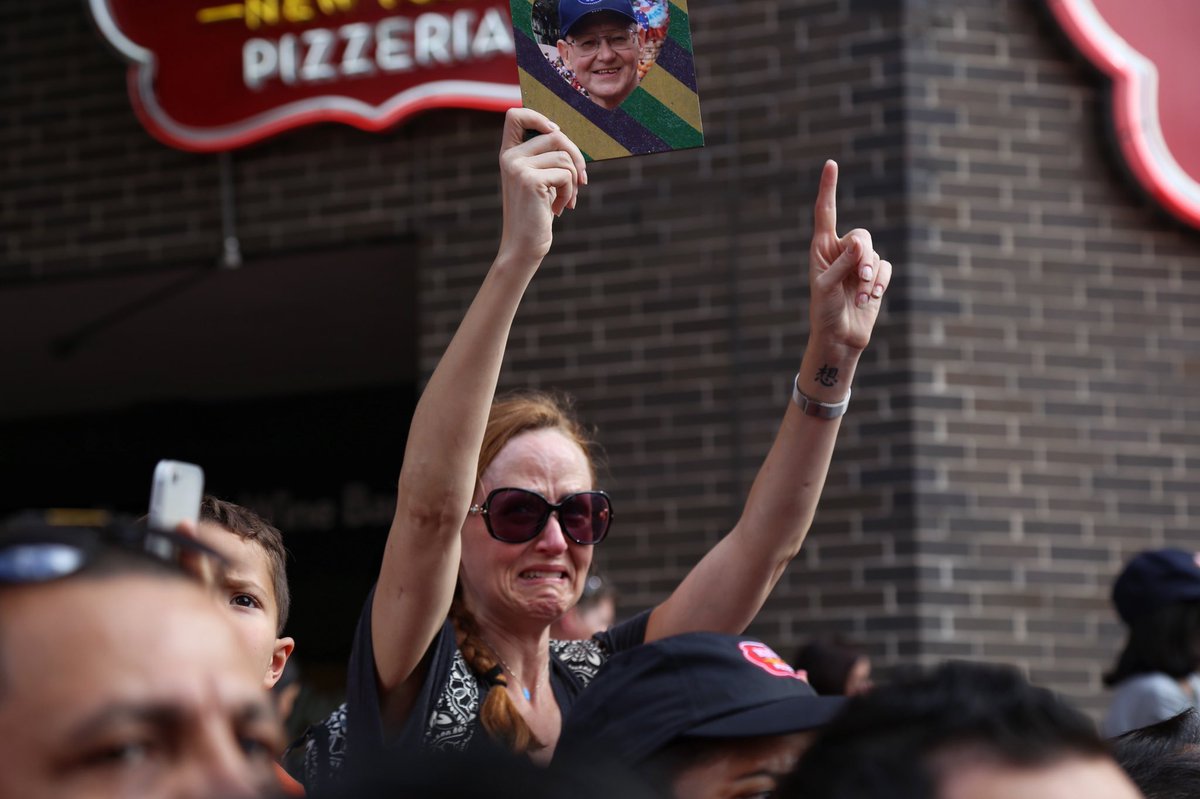 JacobKHOU11's tweet photo. Emotional day for Jennifer. Her dad, lifelong Astros fan, recently lost his battle with cancer. She held up his photo during parade. https://t.co/jPLfMJSBkg