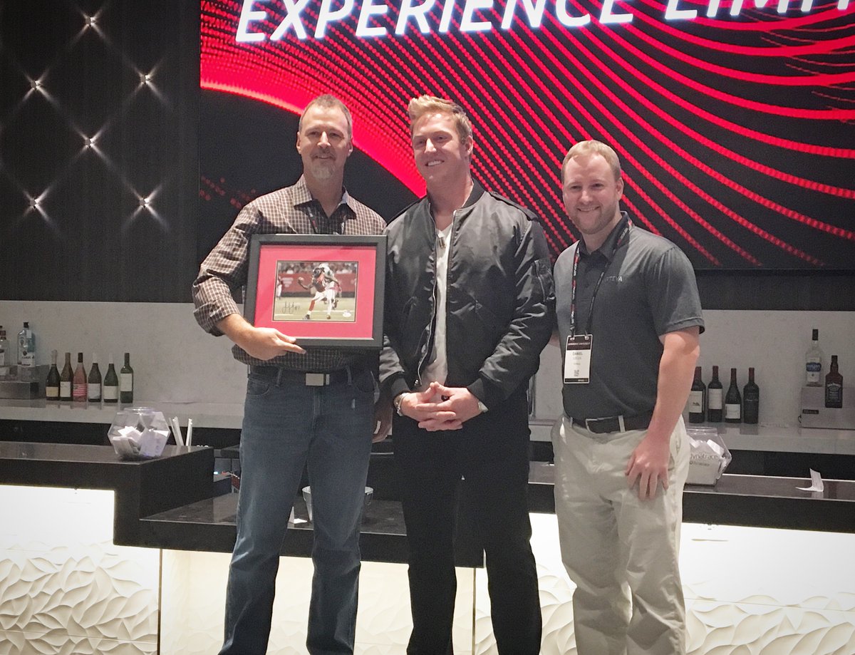 Virteva_Inc's tweet photo. Great #LimitlessIT Atlanta! The winner of our signed @juliojones_11 photo raffle is shown here with @biermann71 @AtlantaFalcons @servicenow https://t.co/cdTYP8jwTa