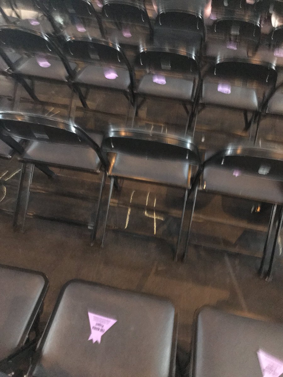 tearinmyarmor's tweet photo. Section 1 of the floor is ready to be purple! Some sec guards even took some to participate! 💜💜@FOBManiaProject @falloutboy @ManiaCharlotte https://t.co/aqCspNXfvw