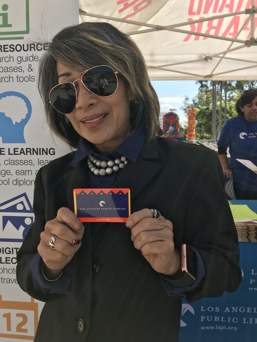 Person holding library card