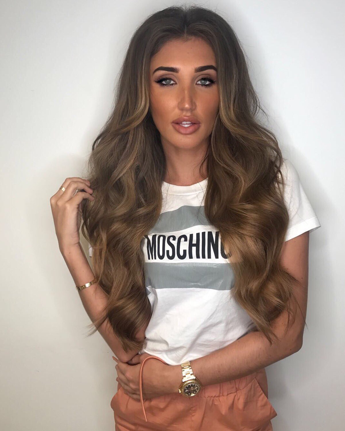 Megan McKenna displays her toned midriff and freshly dyed platinum locks in  stunning snaps