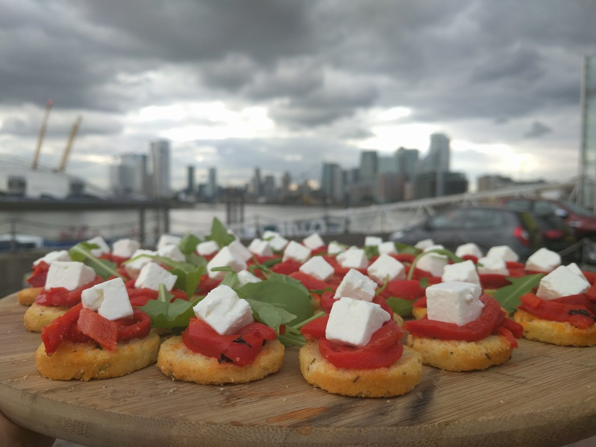 Brilliant photo of our goats cheese and red pepper canapés overlooking the Thames outside The amazing events venue Trinity Buoy Wharf on a very moody looking summers evening! <a href="/artstbw/">Trinity Buoy Wharf</a>