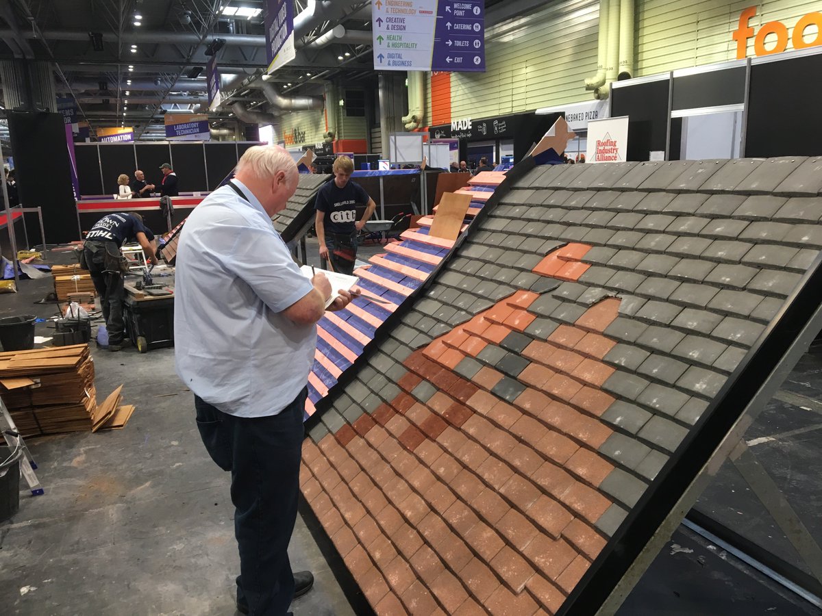 RoofIndAll's tweet photo. #SkillBuild2017 #Roof Slating & Tiling Judge @Bobtheslater checking and marking competitors work so far. @SkillsShow https://t.co/bG1YWmWdEL