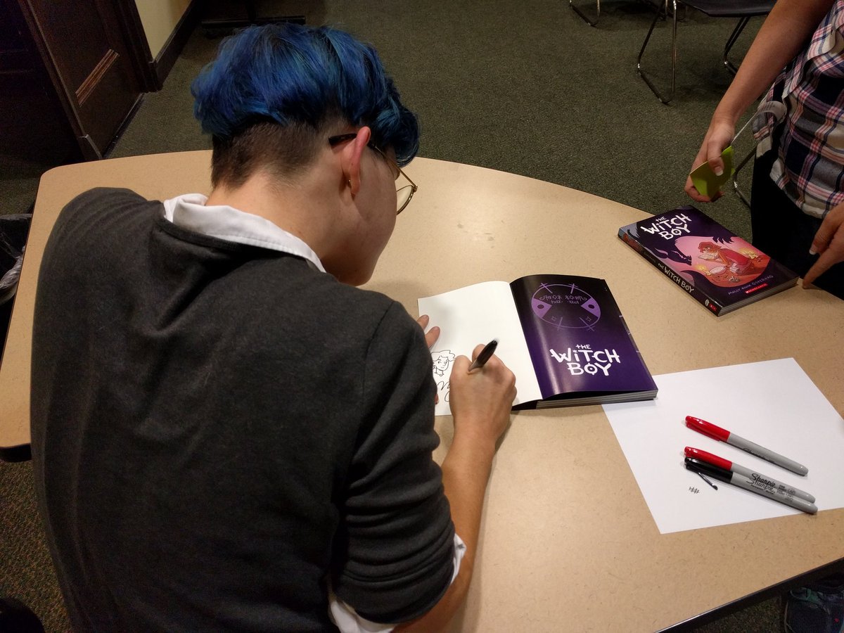 Molly Ostertag signing book