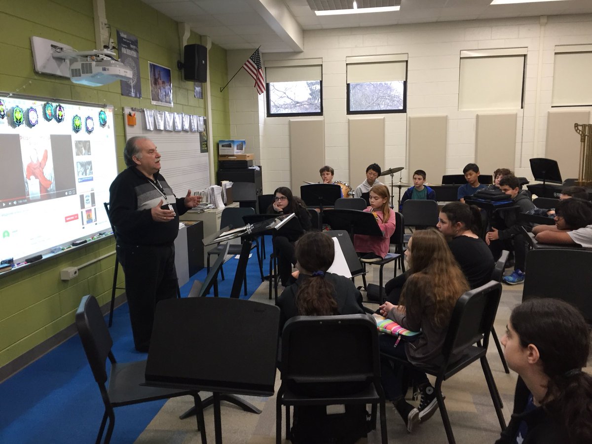 hpforward's tweet photo. Simon Kaplan presenting to 7th grade band about the history of Russia supporting our performance of “Moscow 1941” https://t.co/enaXFBJxhz