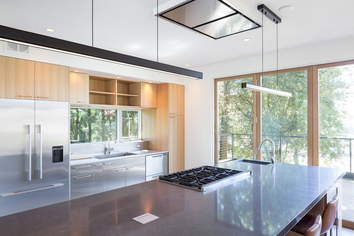 Clean lines, wood accents and stainless steel appliances showcase the perfect kitchen space.
Credit: <a href="/dwell/">dwell</a>