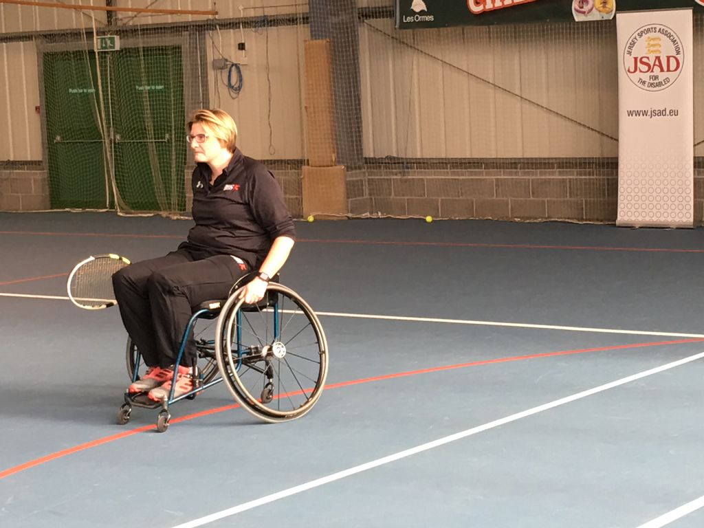 JerseySport's tweet photo. Our CEO giving wheelchair tennis a go at the Disability Sport Awareness Day. Concentration levels high! #inspiringanactivejersey https://t.co/Cb0SOaVMZt