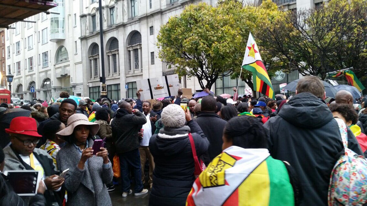 DougColtart's tweet photo. Zimbabweans demonstrating outside the Zimbabwe Embassy in London in solidarity with all those who’ve taken to the streets in Harare, Bulawayo and all across Zimbabwe. #Zimbabwe #SolidariryMarch #MugabeMustGo https://t.co/ntc51Cz1Rj