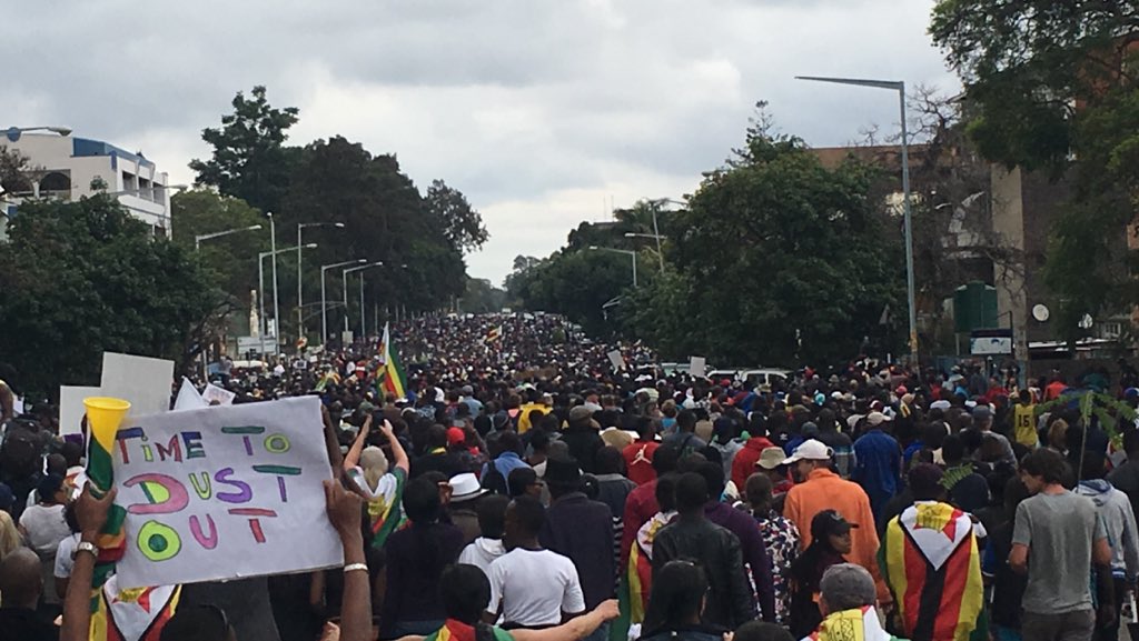 DougColtart's tweet photo. Herbert Chitepo Avenue was PACKED as far as the eye could see in both directions. I haven’t seen official figures yet but it looked like hundreds of thousands. #Zimbabwe #SolidariryMarch #MugabeMustGo https://t.co/KK3wVQP5iR