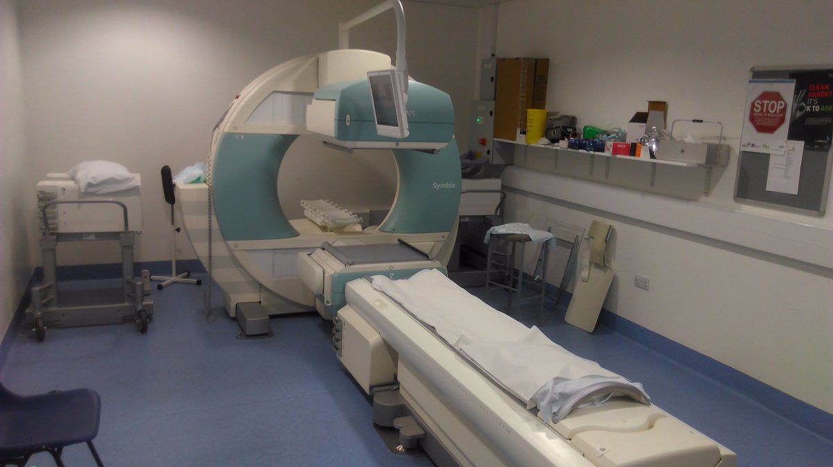 12/This is a gamma camera in Nuclear Medicine – it takes pictures by detecting gamma rays from radioactive isotopes injected in patients