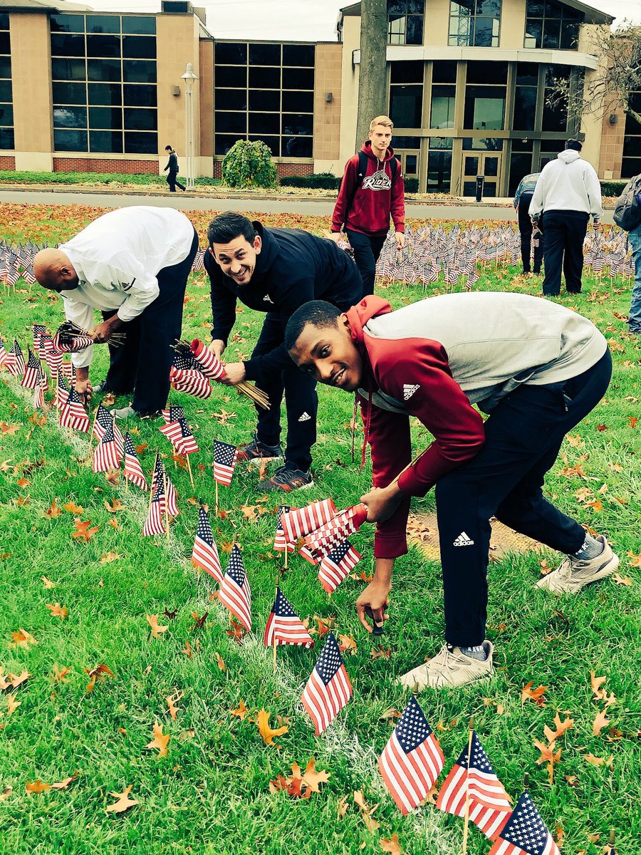 RiderAthletics's tweet photo. Student-athletes & coaches spent time planting flags on the Campus Mall today in honor of #VeteransDay this week. #RiderVets @RiderVeterans https://t.co/0dfTH8g5vW